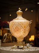 Decorative lamp with intricate designs on a blurred background