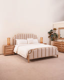 The elegant bed set adds softness and style, perfectly complementing the contemporary design of the space.