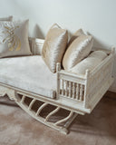 A handcrafted Deewan brings warmth and style to this refined living room setting.


