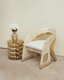 Torrey chair accompanied by a coordinating side table, beautifully arranged in a contemporary living space.