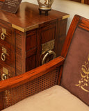 Beautifully crafted chair set paired with decorative cushions and accessories, creating a warm and inviting seating area.

