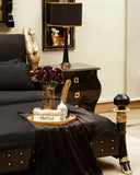 Accessory detail on Swan Bed Set, adding contrast to the black bedding.

