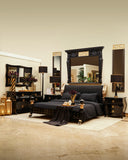 Swan Bed Set in black finish styled in a modern bedroom with layered bedding.

