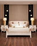 Luxury bedroom with a white bed, nightstands, and lamps.